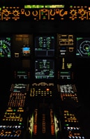 A view of the cockpit of an airplane at night