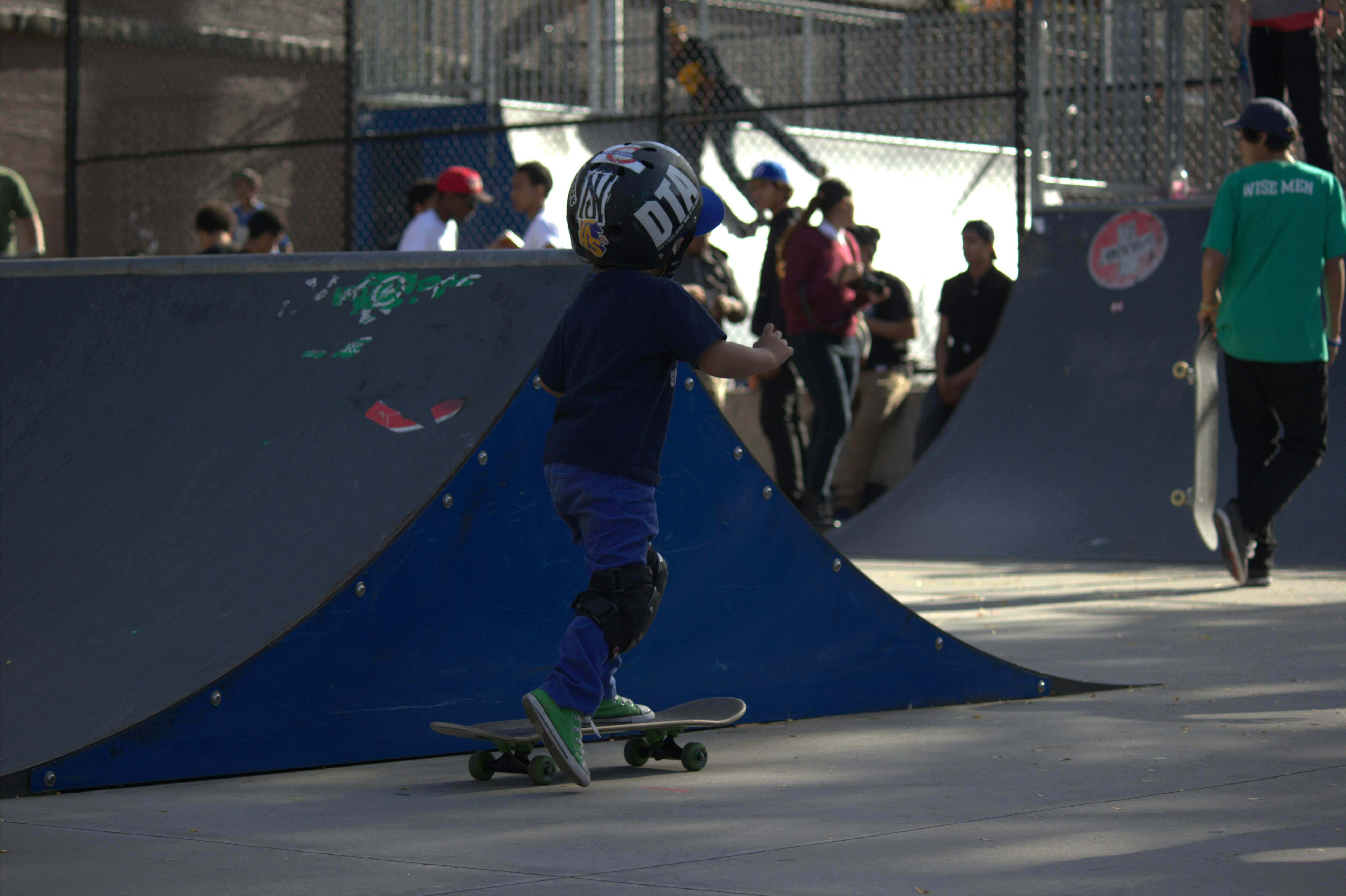 A man riding a skateboard on top of a ramp