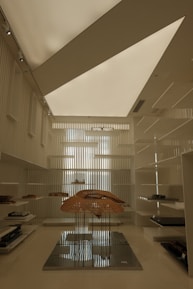 A room with a large umbrella in the middle of it