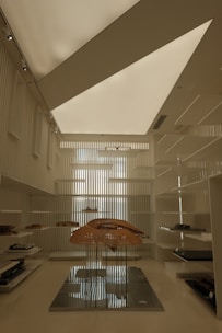 A room with a large umbrella in the middle of it