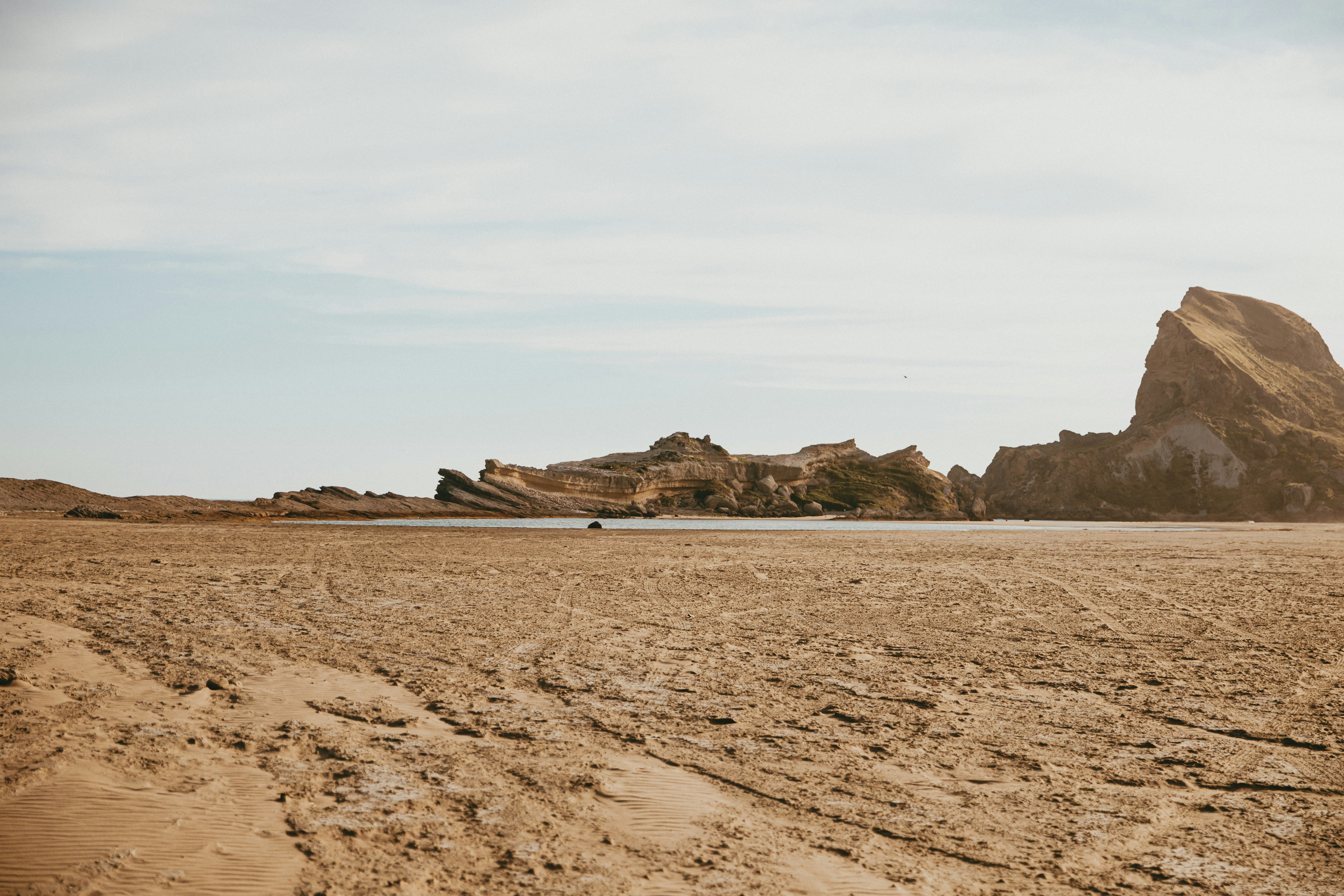 A dirt road in the middle of a desert