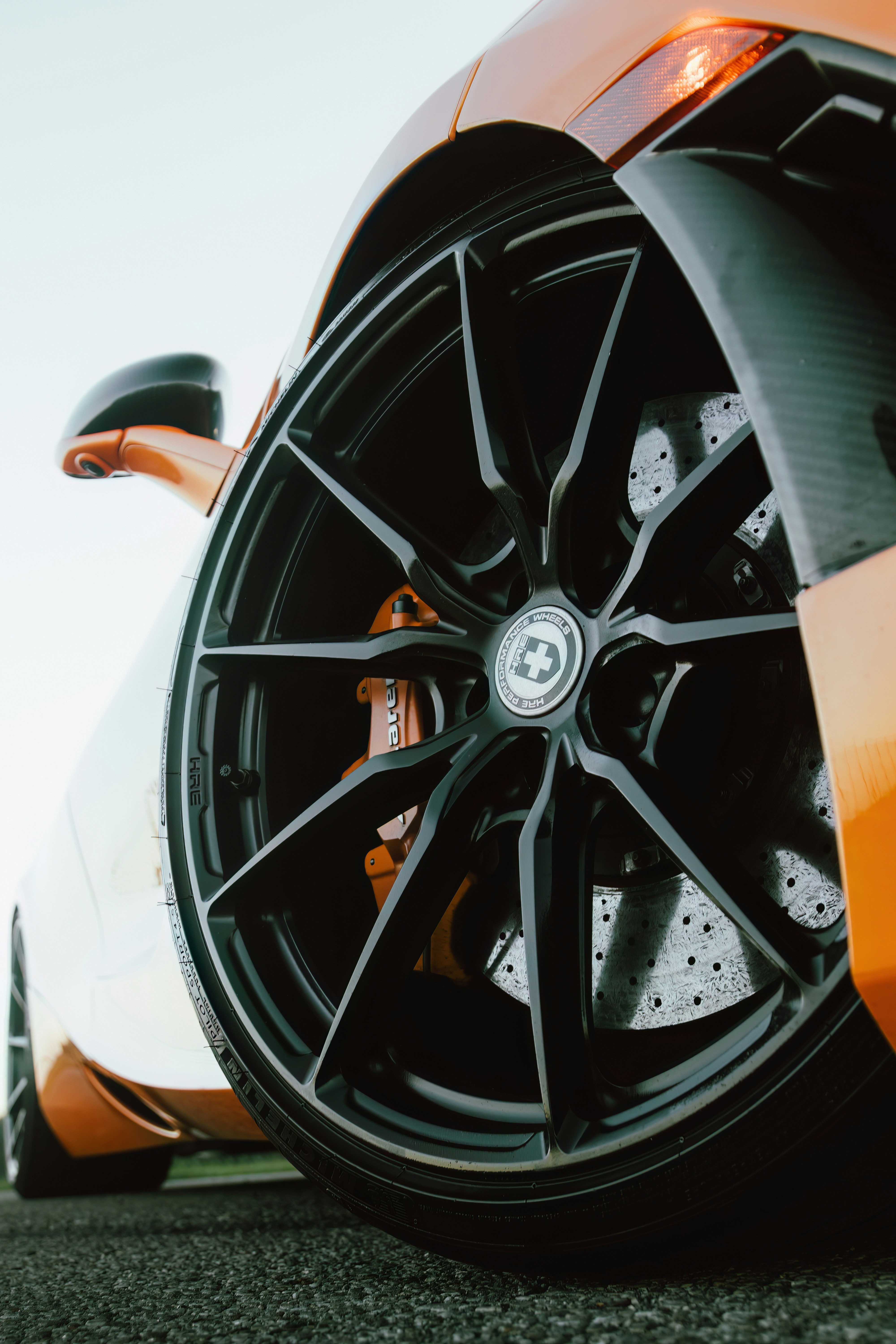 A close up of a sports car tire photo Free Columbus Image on Unsplash