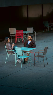 A couple of people sitting at a table