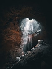 A cave with a healing light coming out of it 