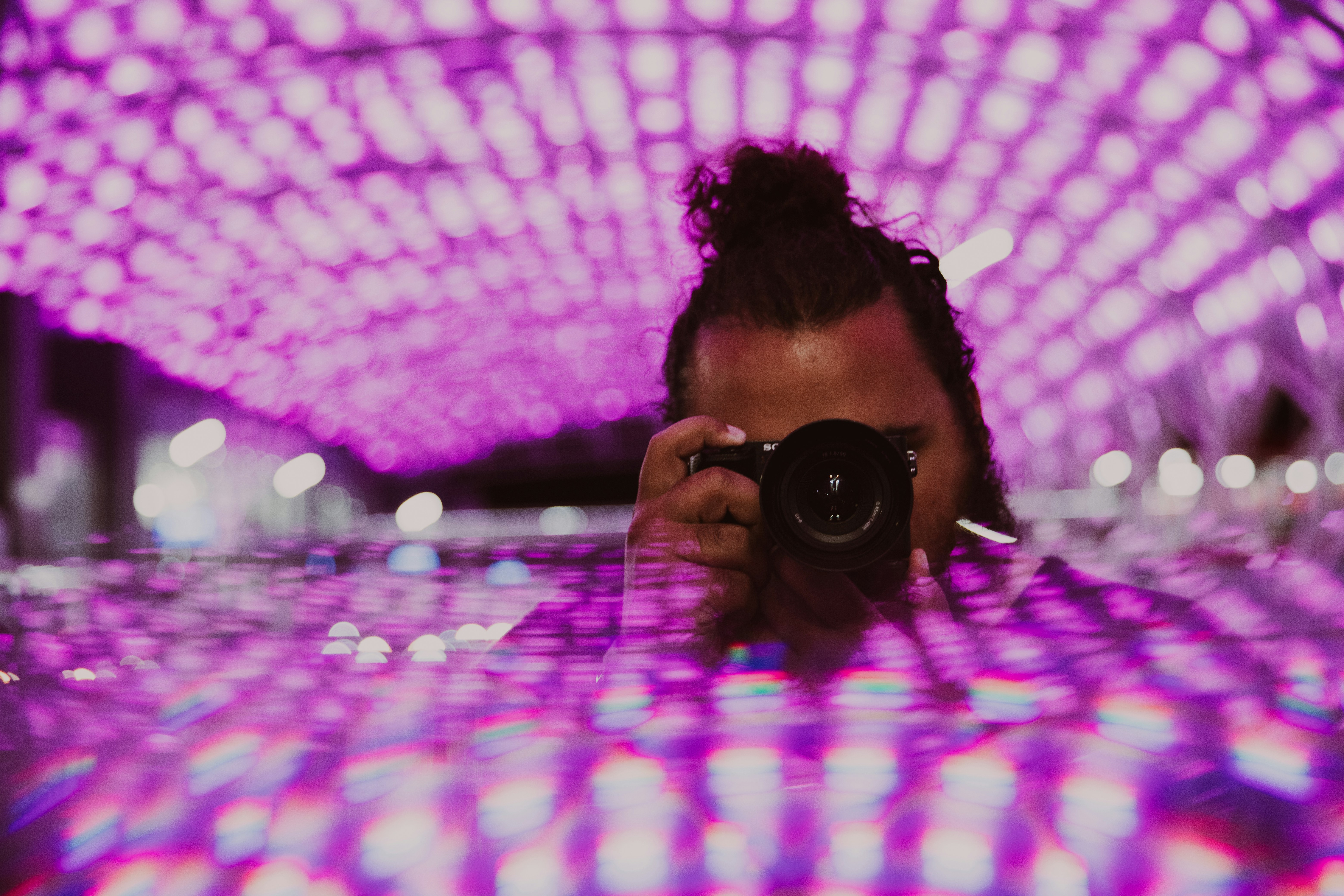 A woman taking a picture of herself in a mirror
