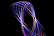 A long exposure photo of a blue and red light