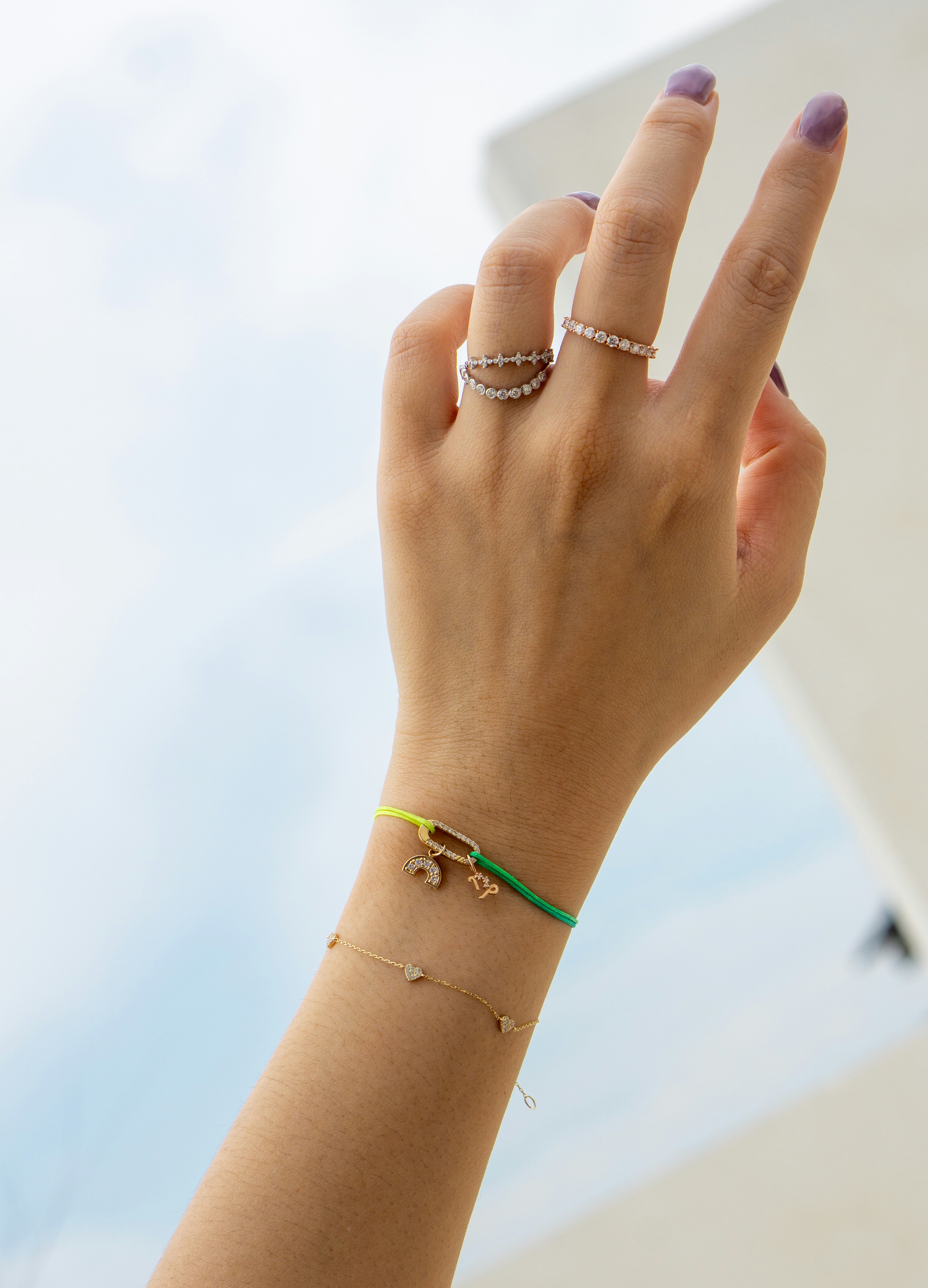 A woman's hand holding up a peace sign