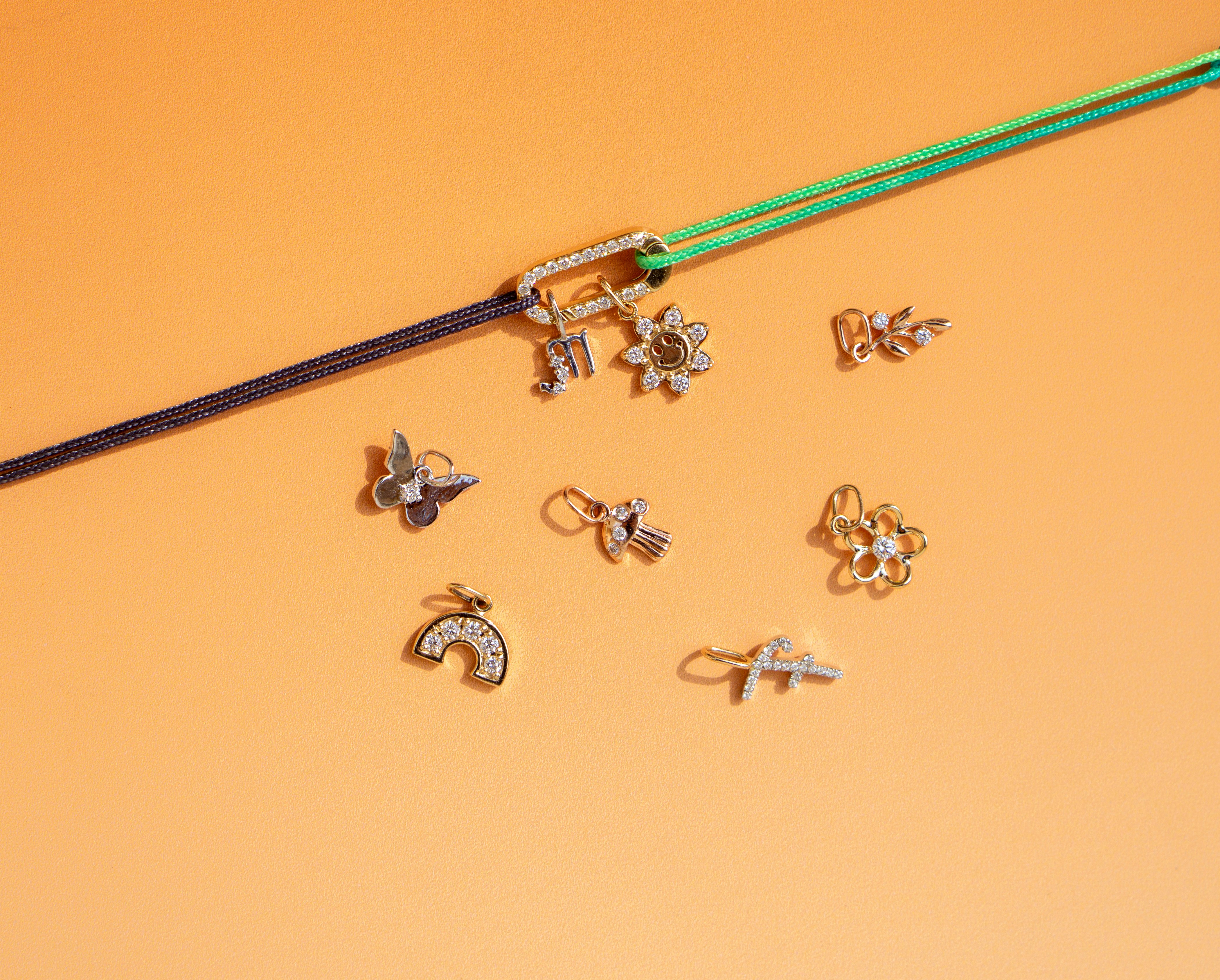 A pair of scissors next to a bunch of earrings