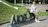 A woman sitting on the letters of a sign