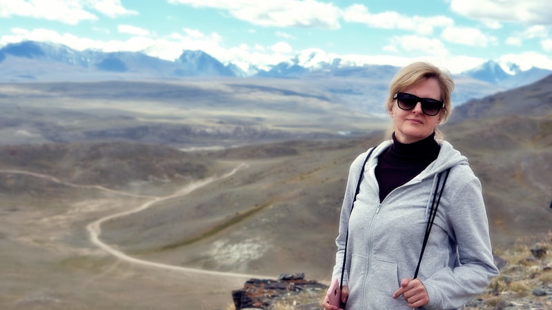 Confident woman on mountaintop