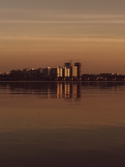 A large body of water with a city in the background