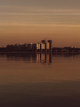 A large body of water with a city in the background