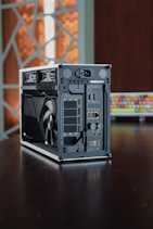 A computer case sitting on top of a wooden table