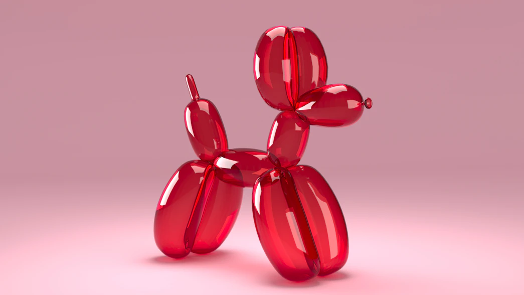 A red balloon dog on a pink background