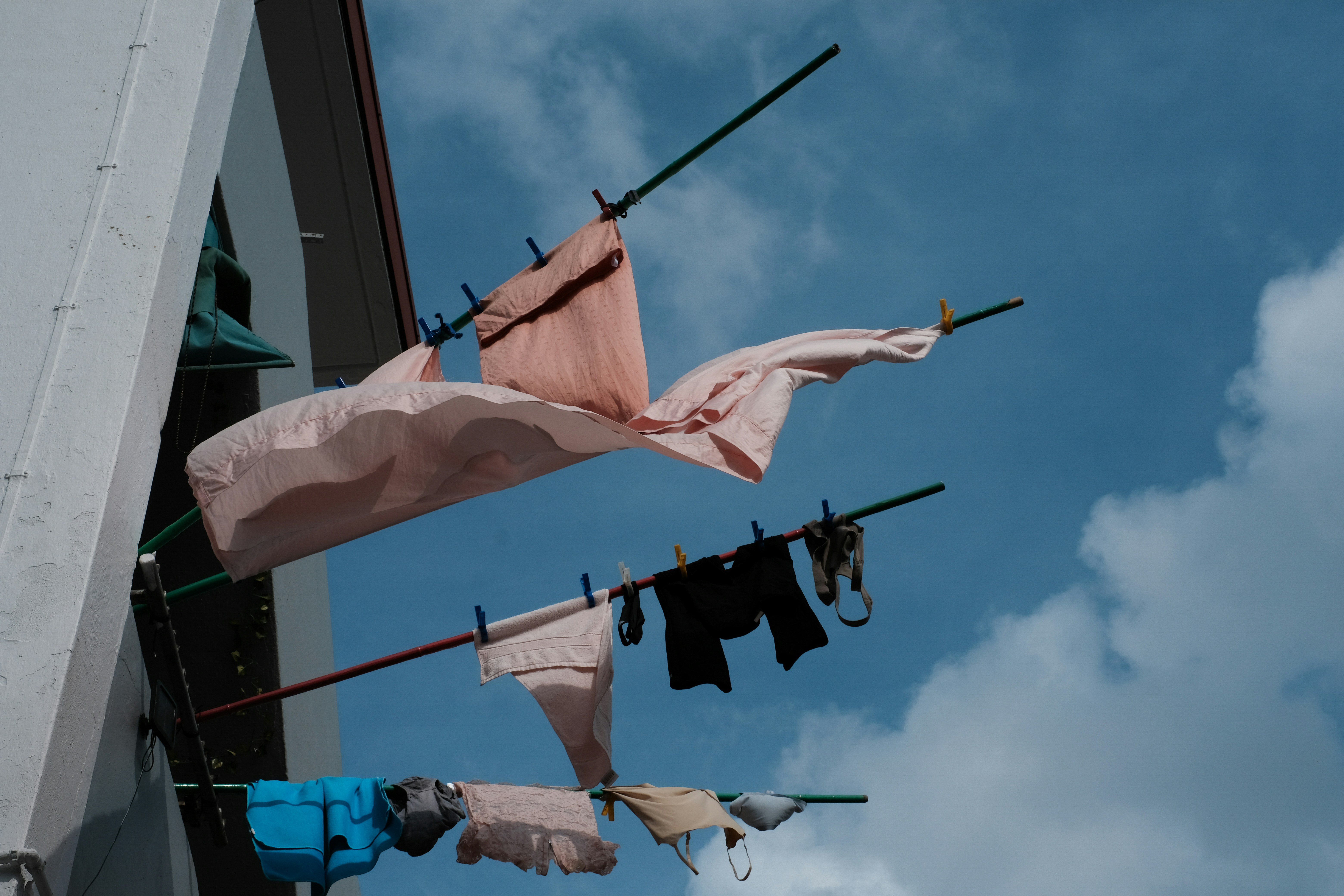 A group of clothes hanging from a clothes line