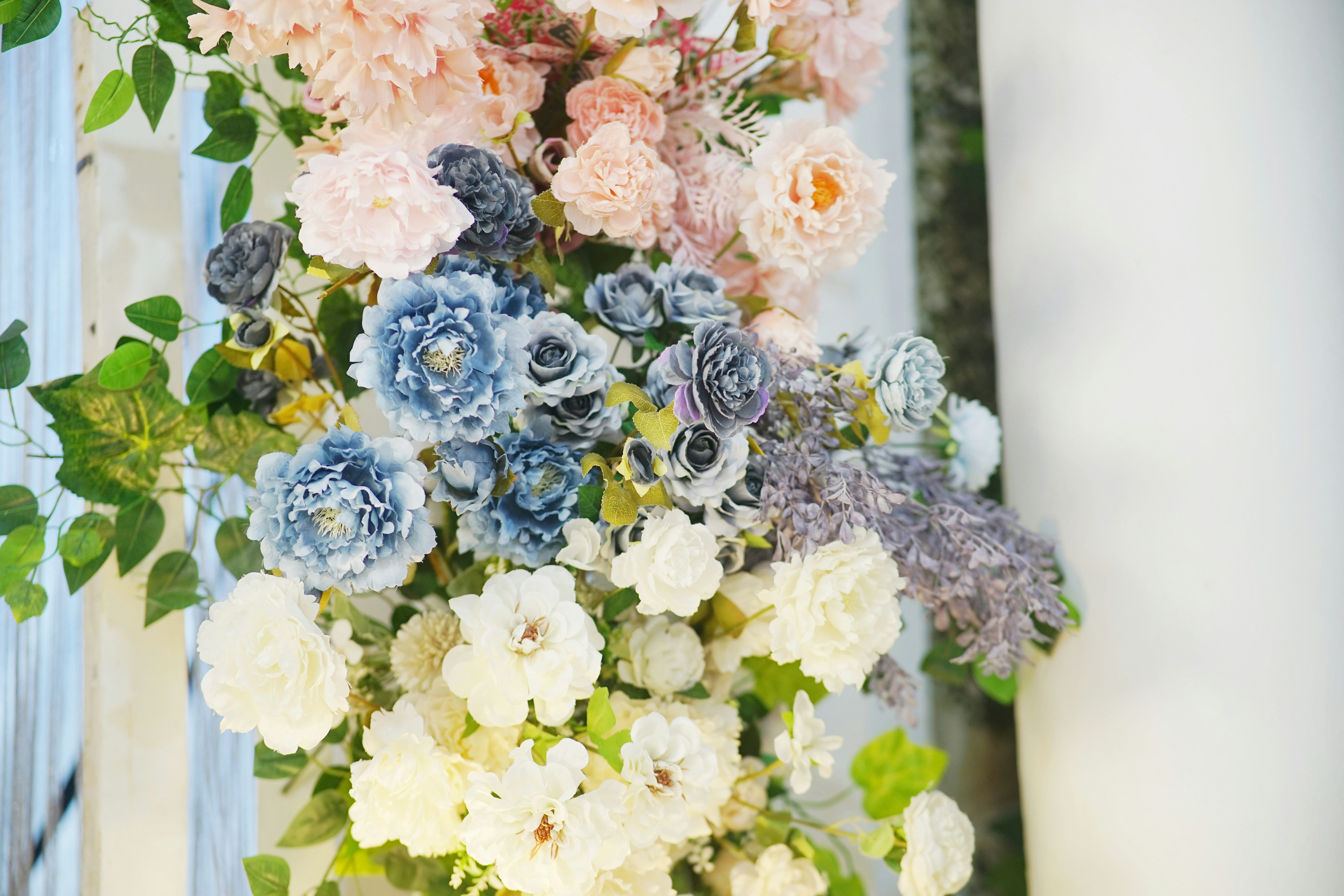 A tall vase filled with lots of flowers
