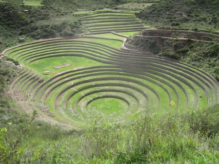 A large circular structure in the middle of a field