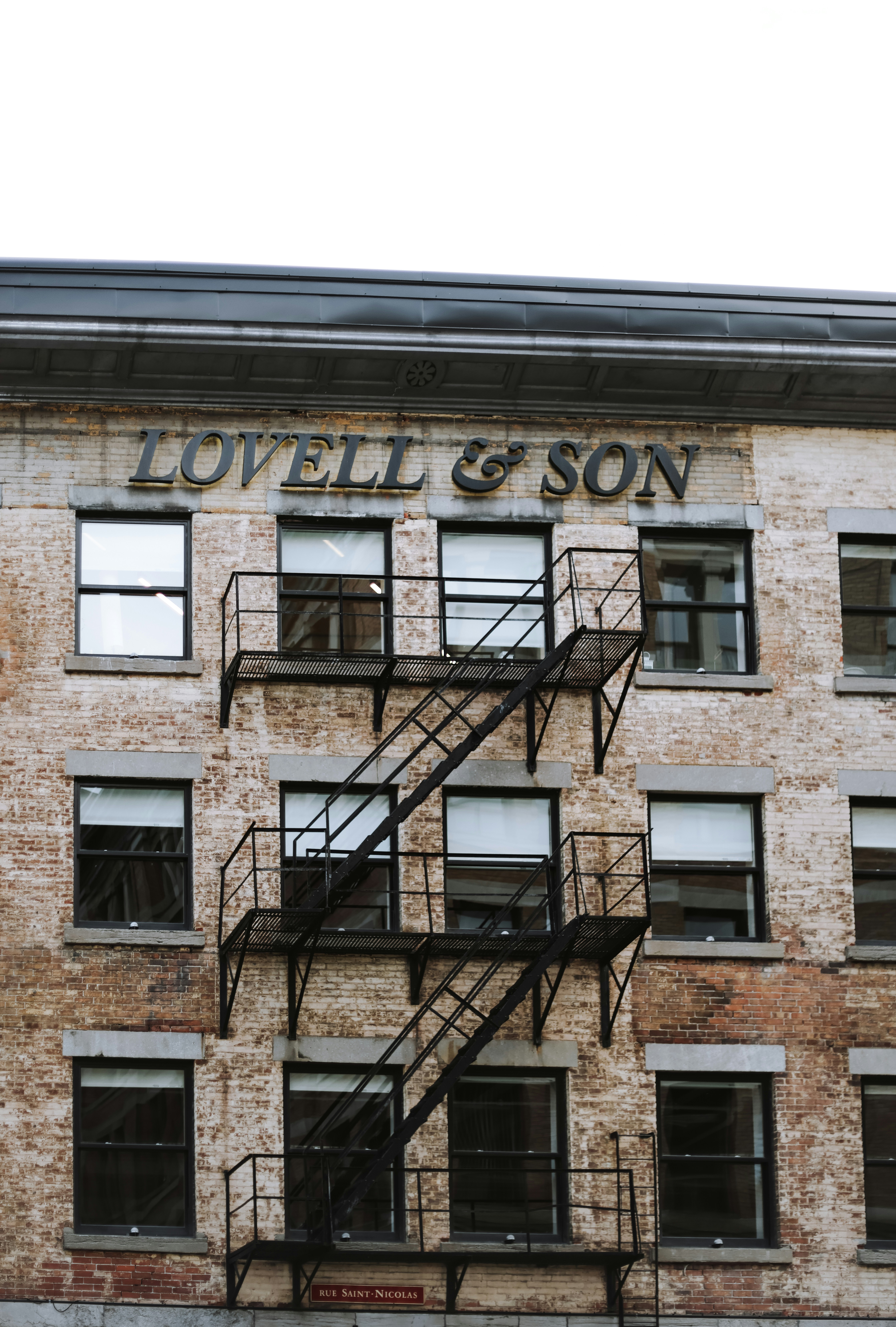 A brick building with a fire escape next to it