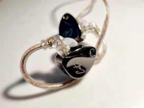 A pair of ear buds sitting on top of a table