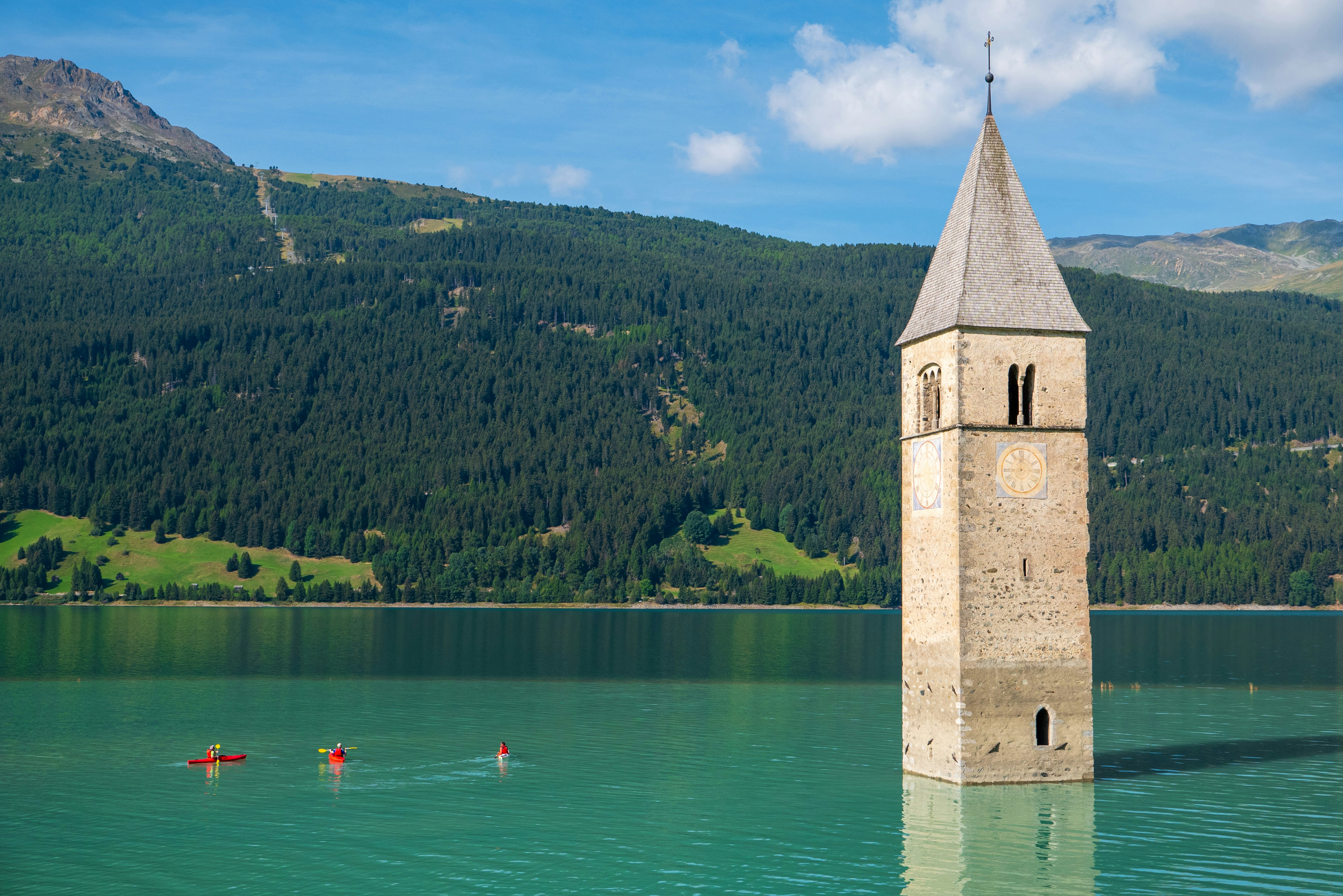 A tower in the middle of a body of water