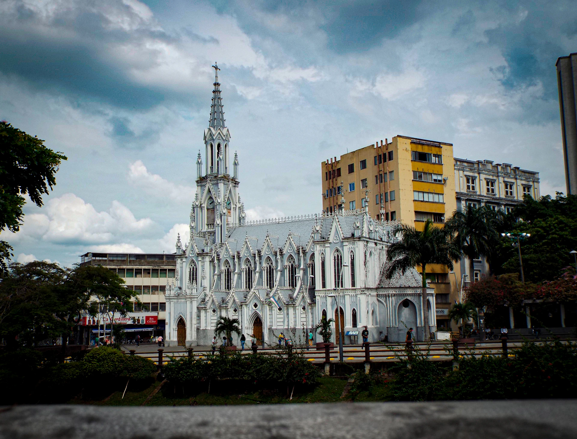 A large white building with a tall tower