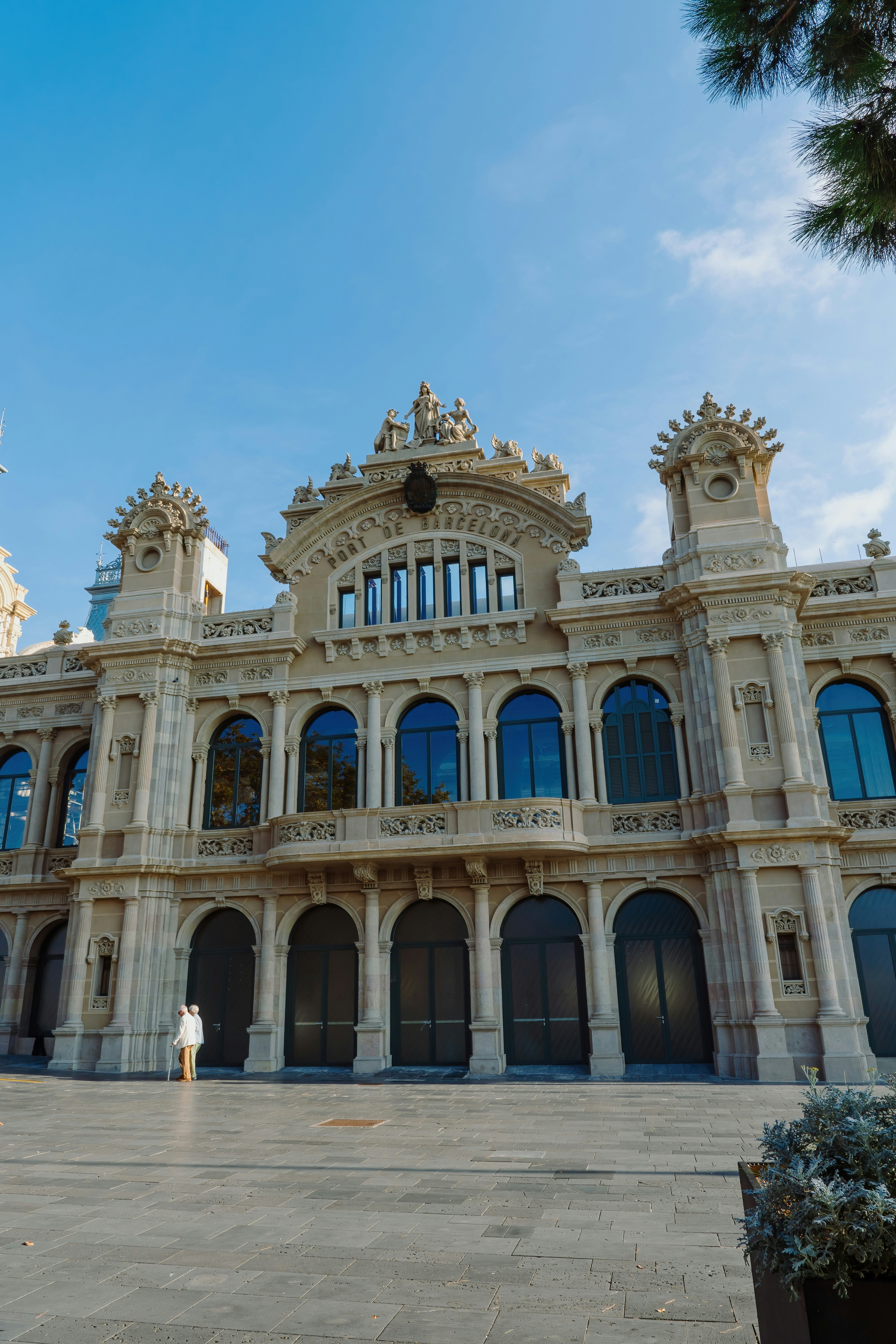 A large white building with many windows and arches