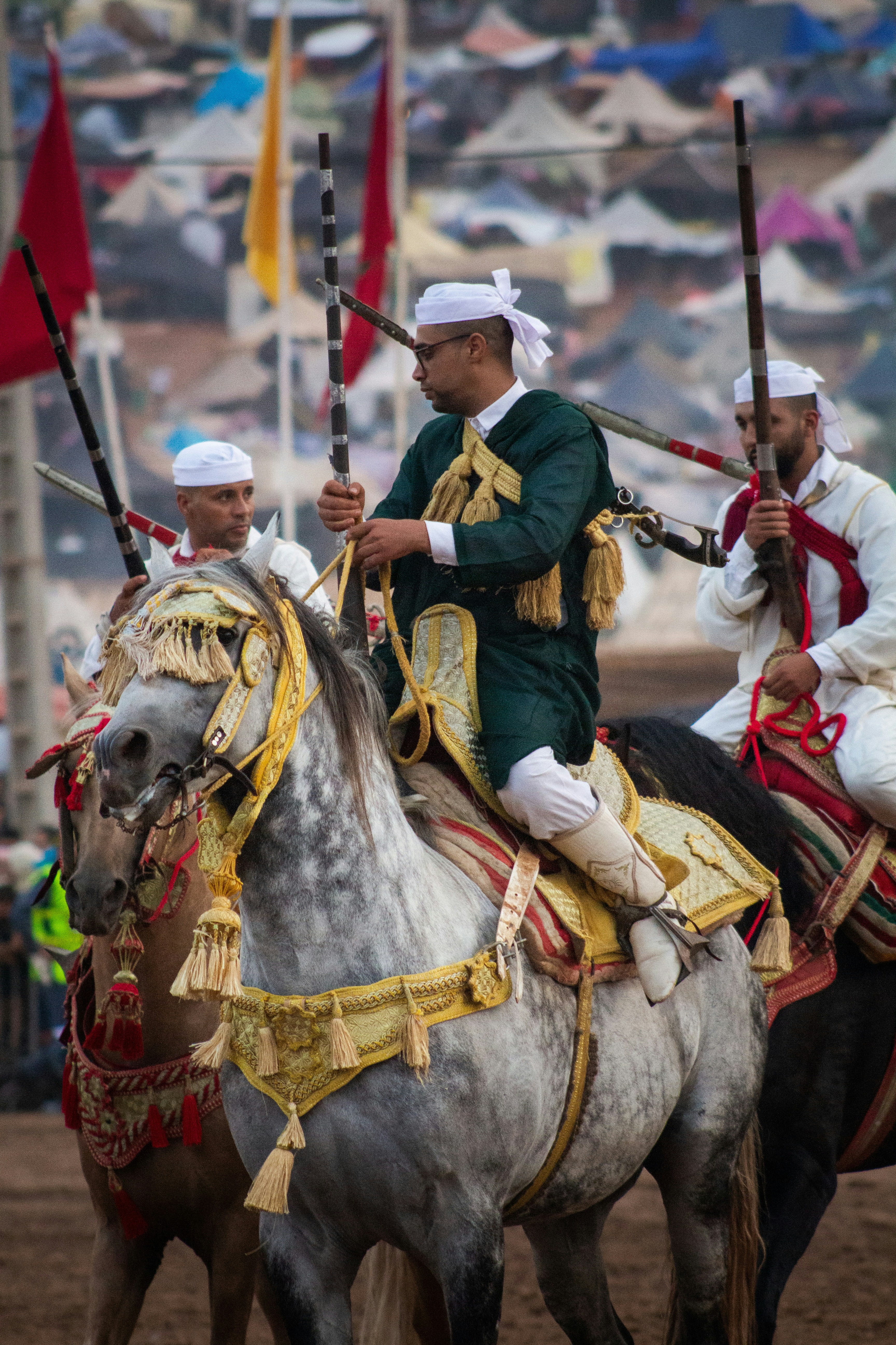 A group of men riding on the backs of horses