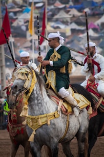 A group of men riding on the backs of horses