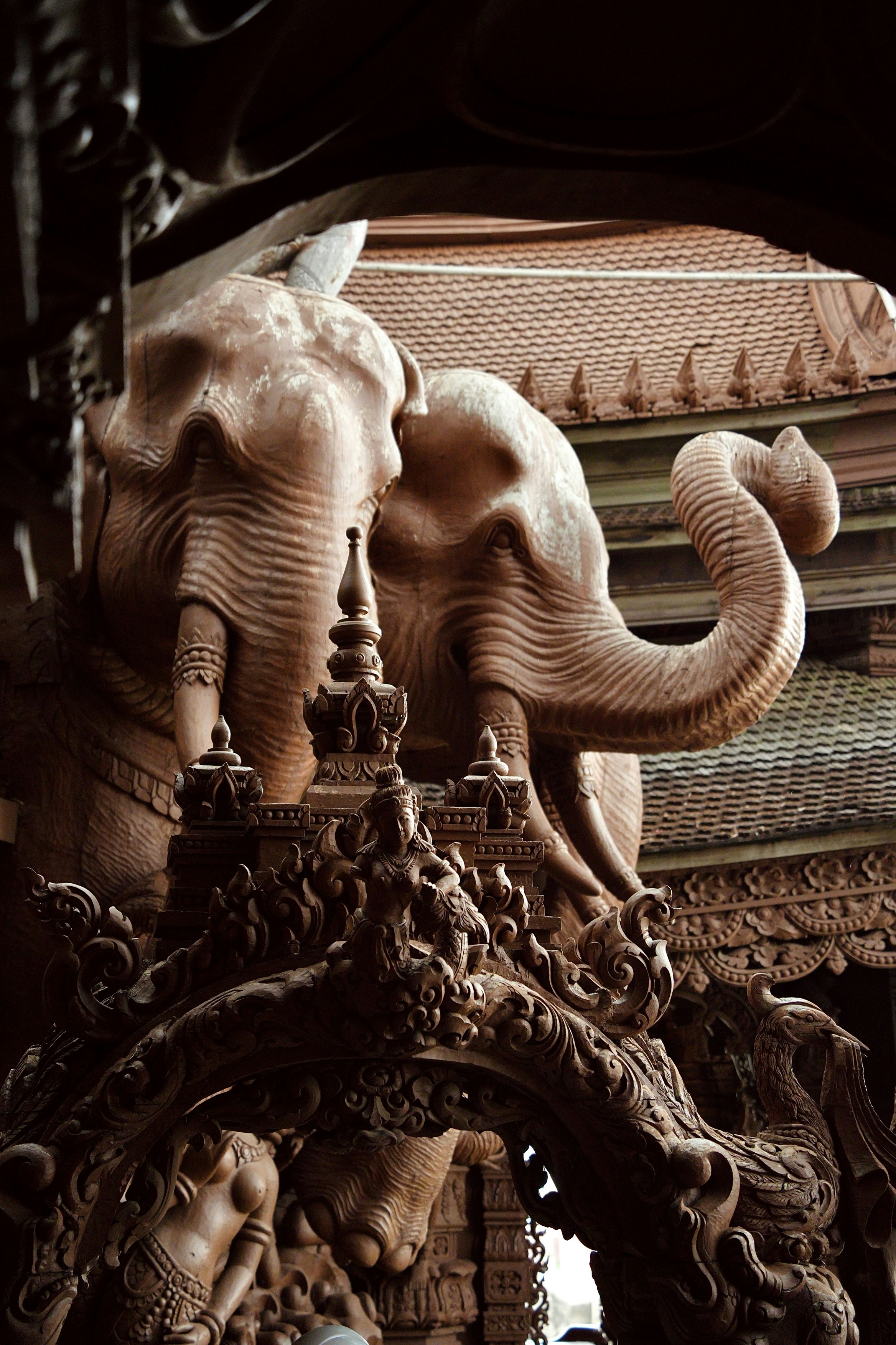 A statue of an elephant on top of a building