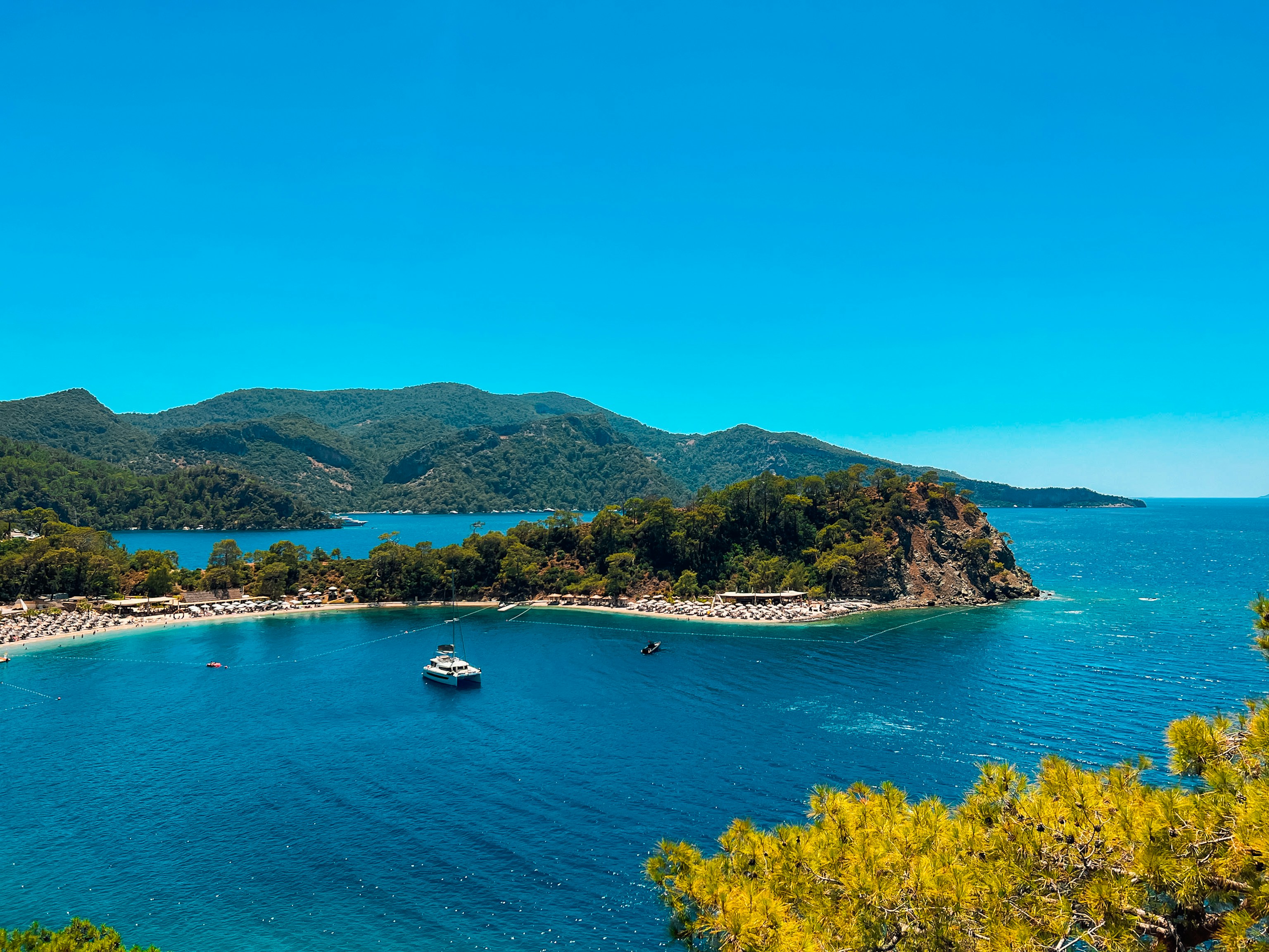 A view of a beach with a boat in the water