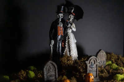 A couple of skeletons standing next to each other