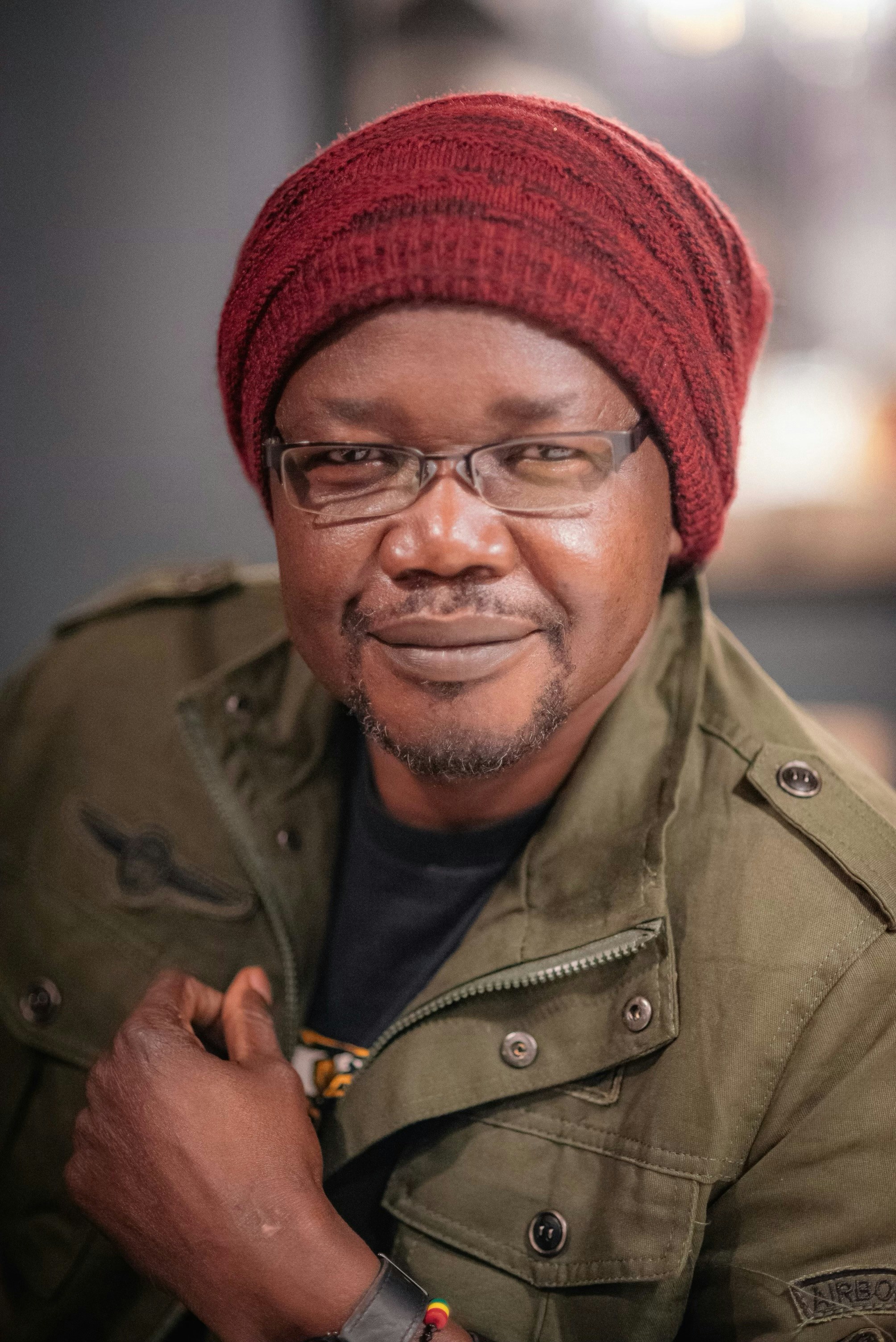 A man wearing a red hat and glasses