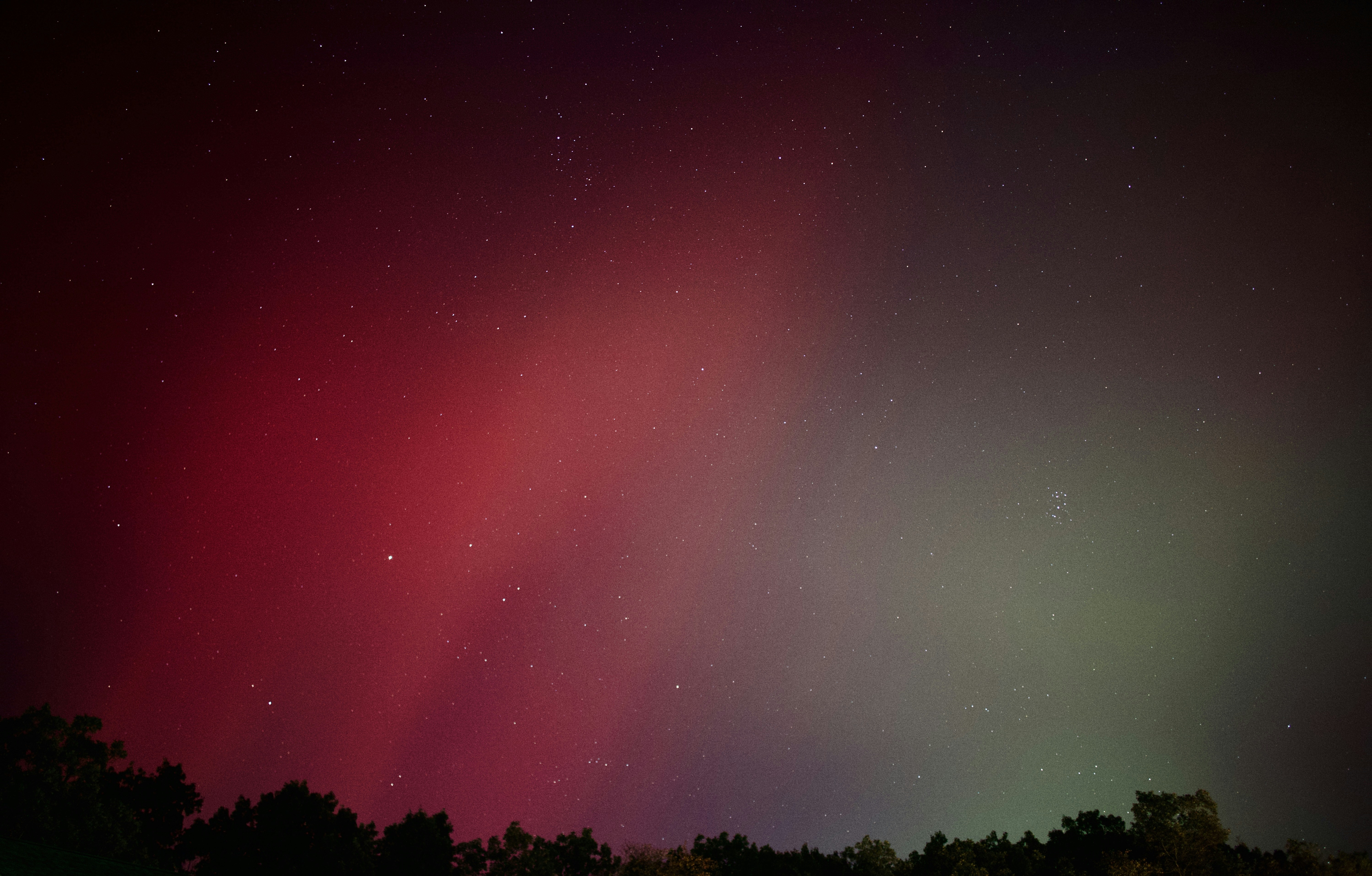 Callanish Standing Stones silhouetted against a green Aurora Borealis sky on the Isle of Lewis