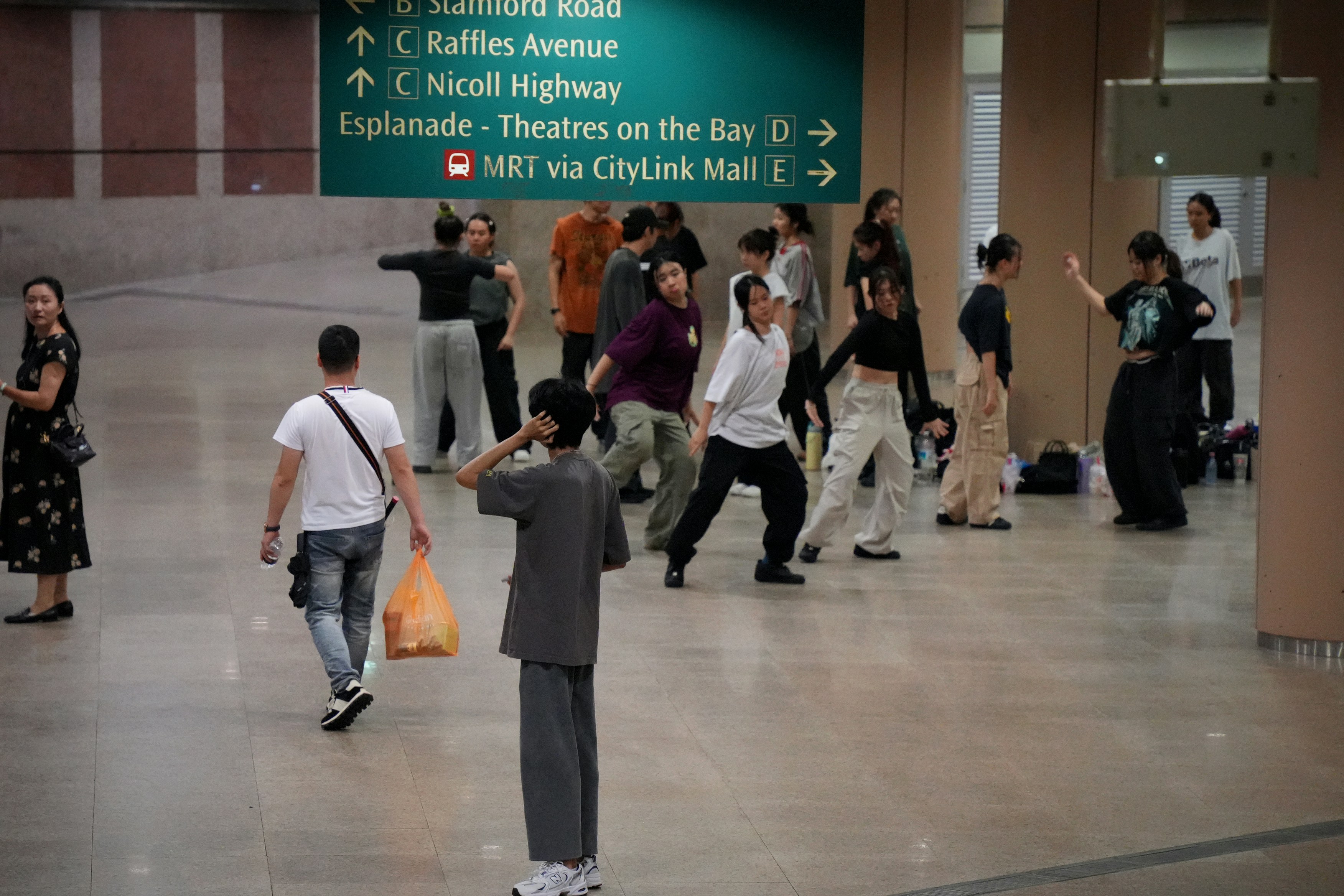 A group of people standing around a terminal