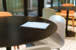 A cell phone sitting on top of a wooden table