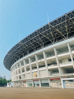 A large white building with a sky background