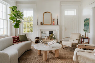 A living room filled with furniture and a fire place