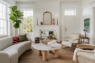 A living room filled with furniture and a fire place