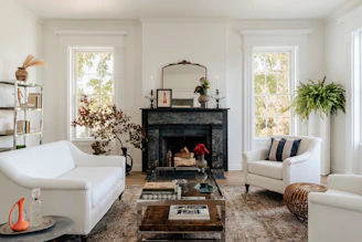 A living room filled with furniture and a fire place