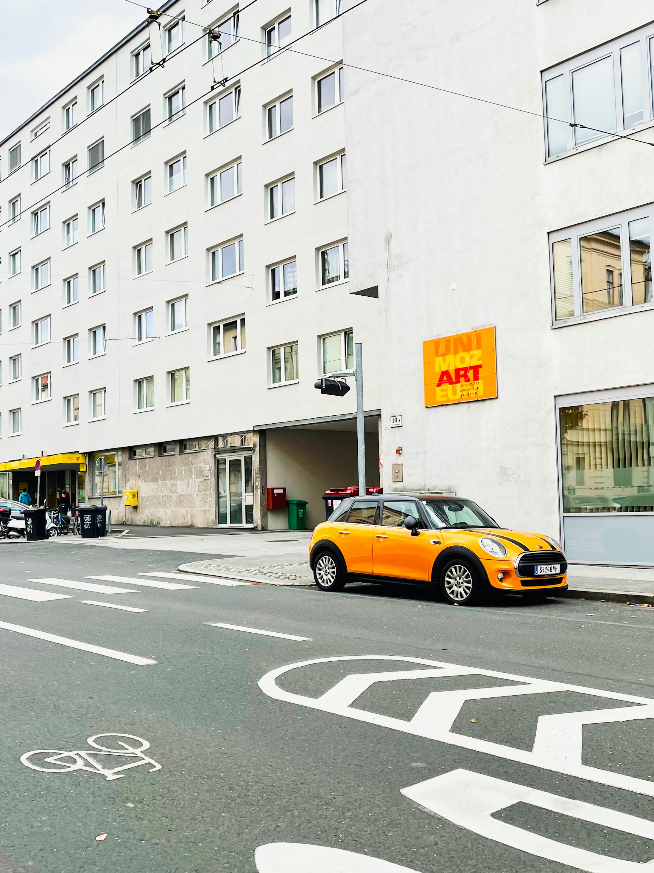 A yellow car parked on the side of a street photo – Free Wallpaper ...