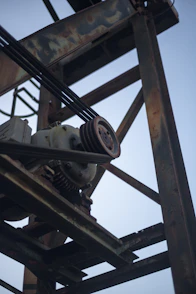 A close up of a metal structure with a clock on it