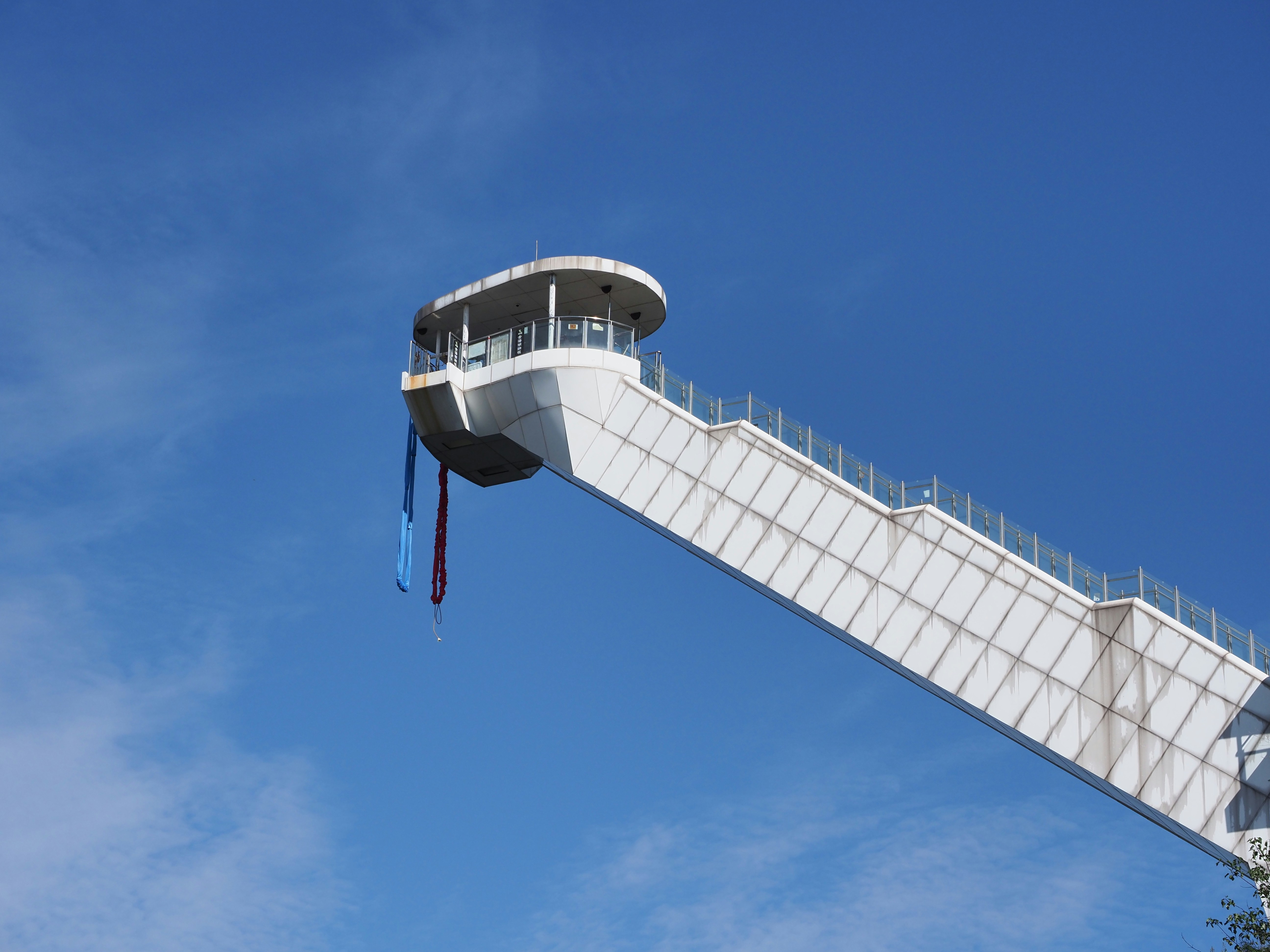 A tall white structure with a sky background