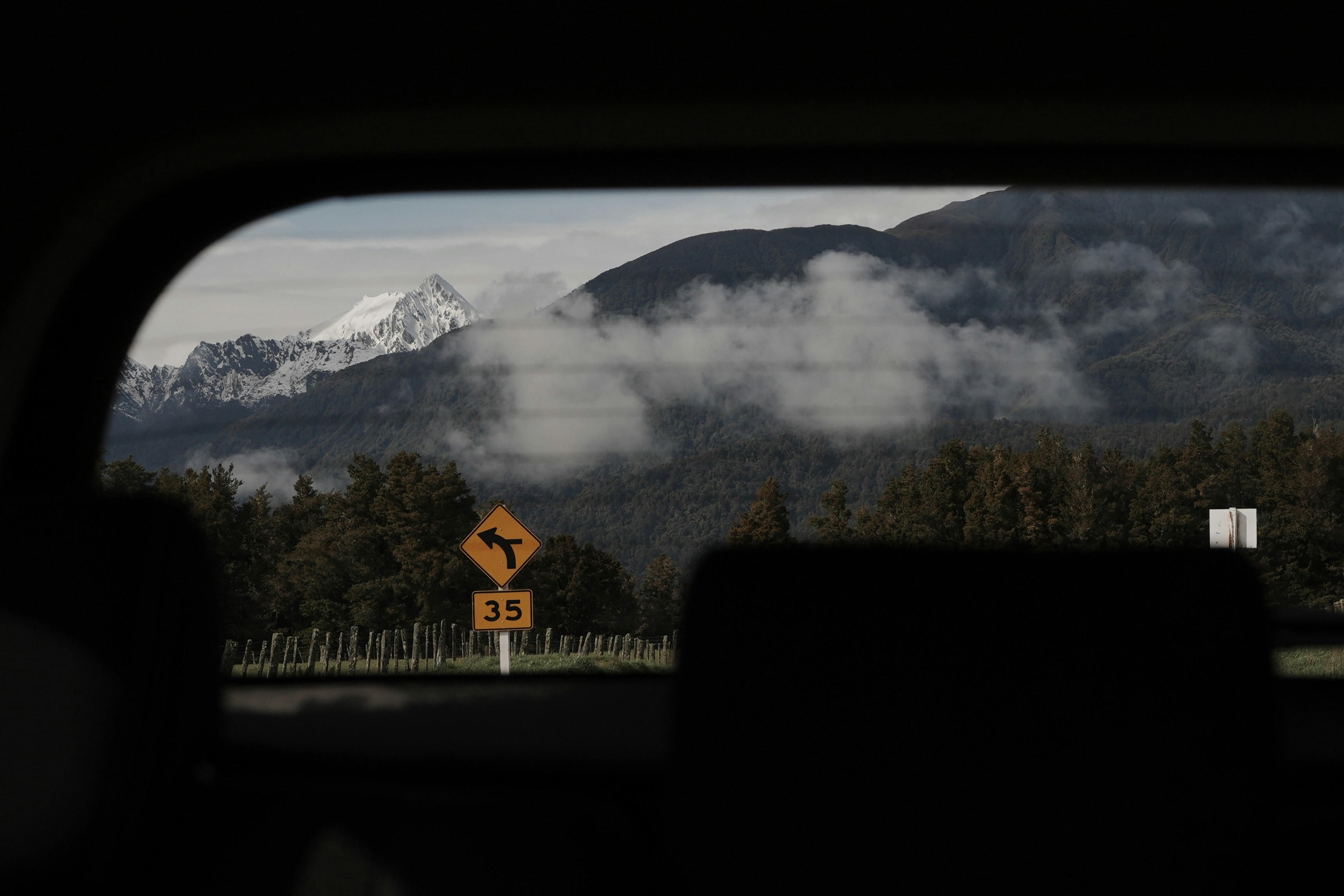A view of the mountains from inside a car