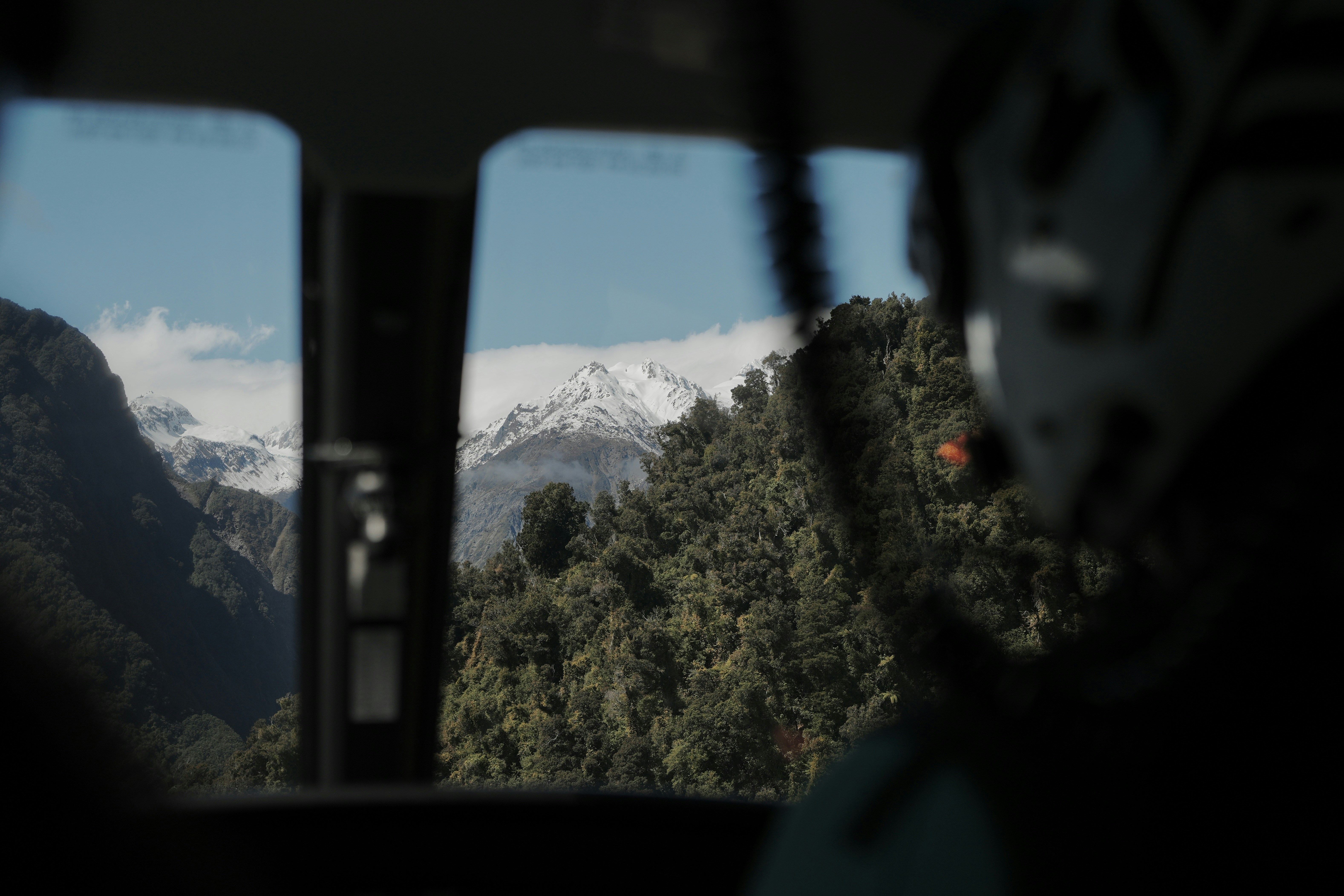 A view of the mountains from inside a vehicle