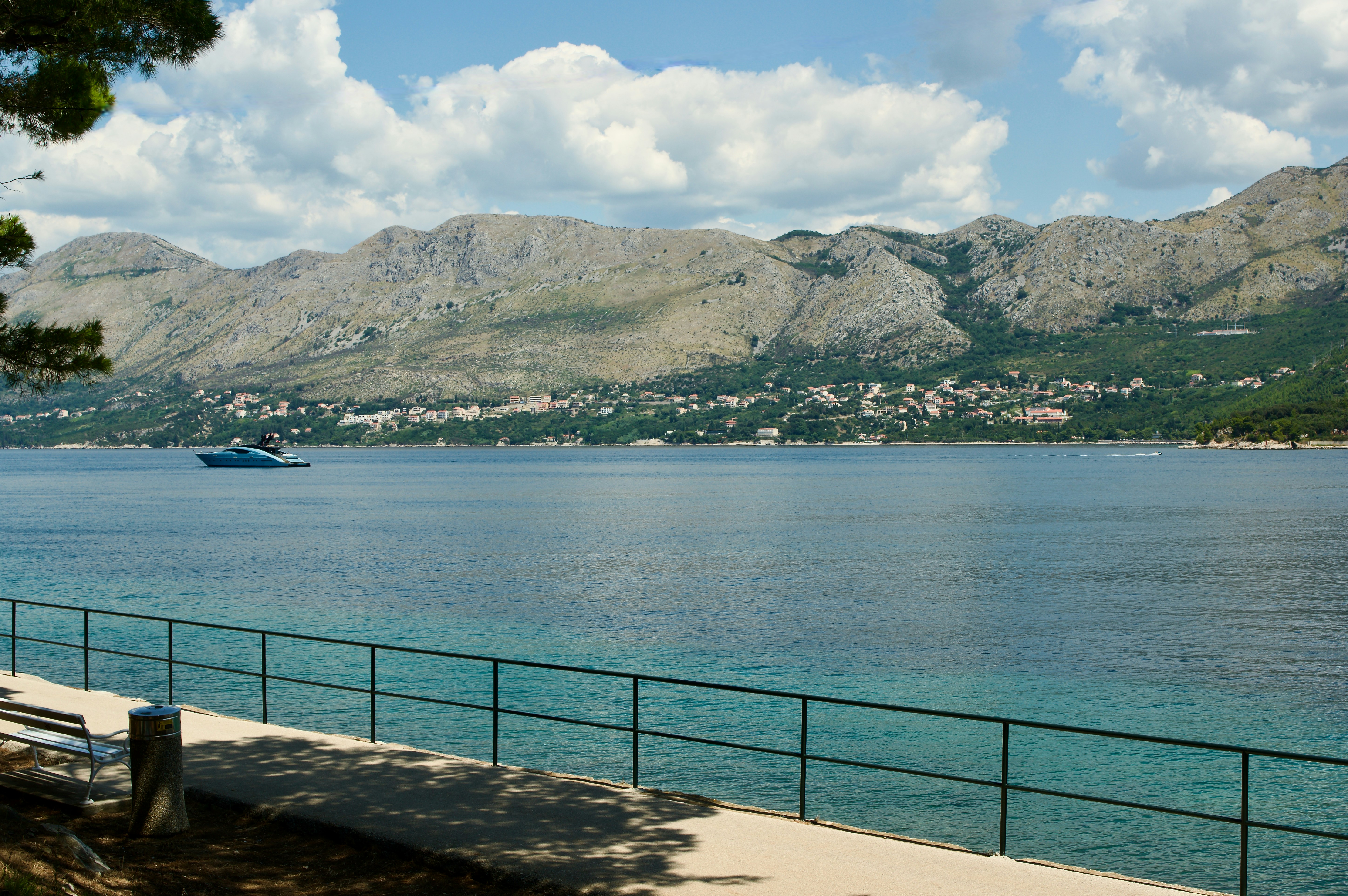 A large body of water with mountains in the background
