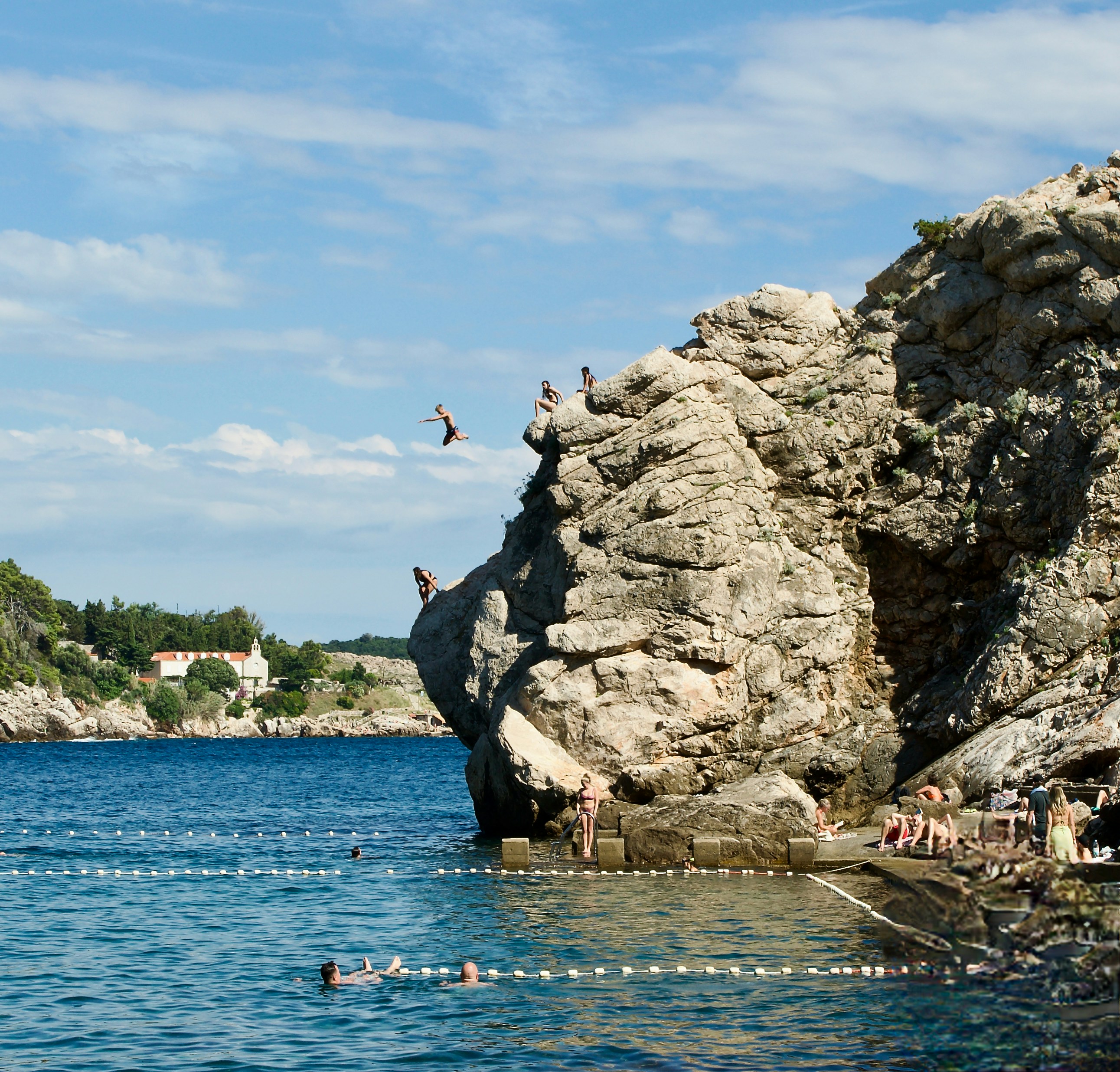 A group of people swimming in a body of water