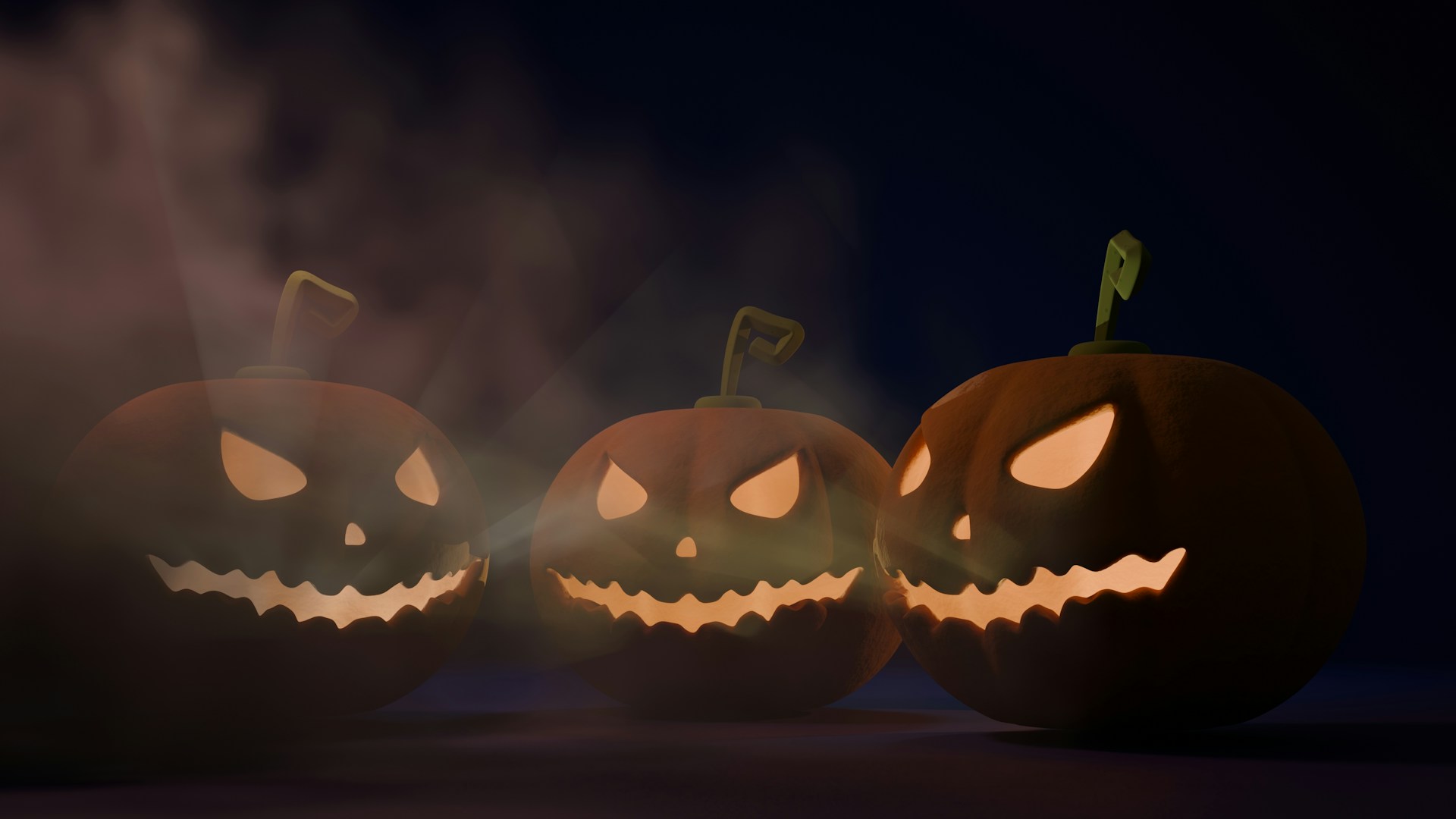 A group of carved pumpkins sitting on top of a table