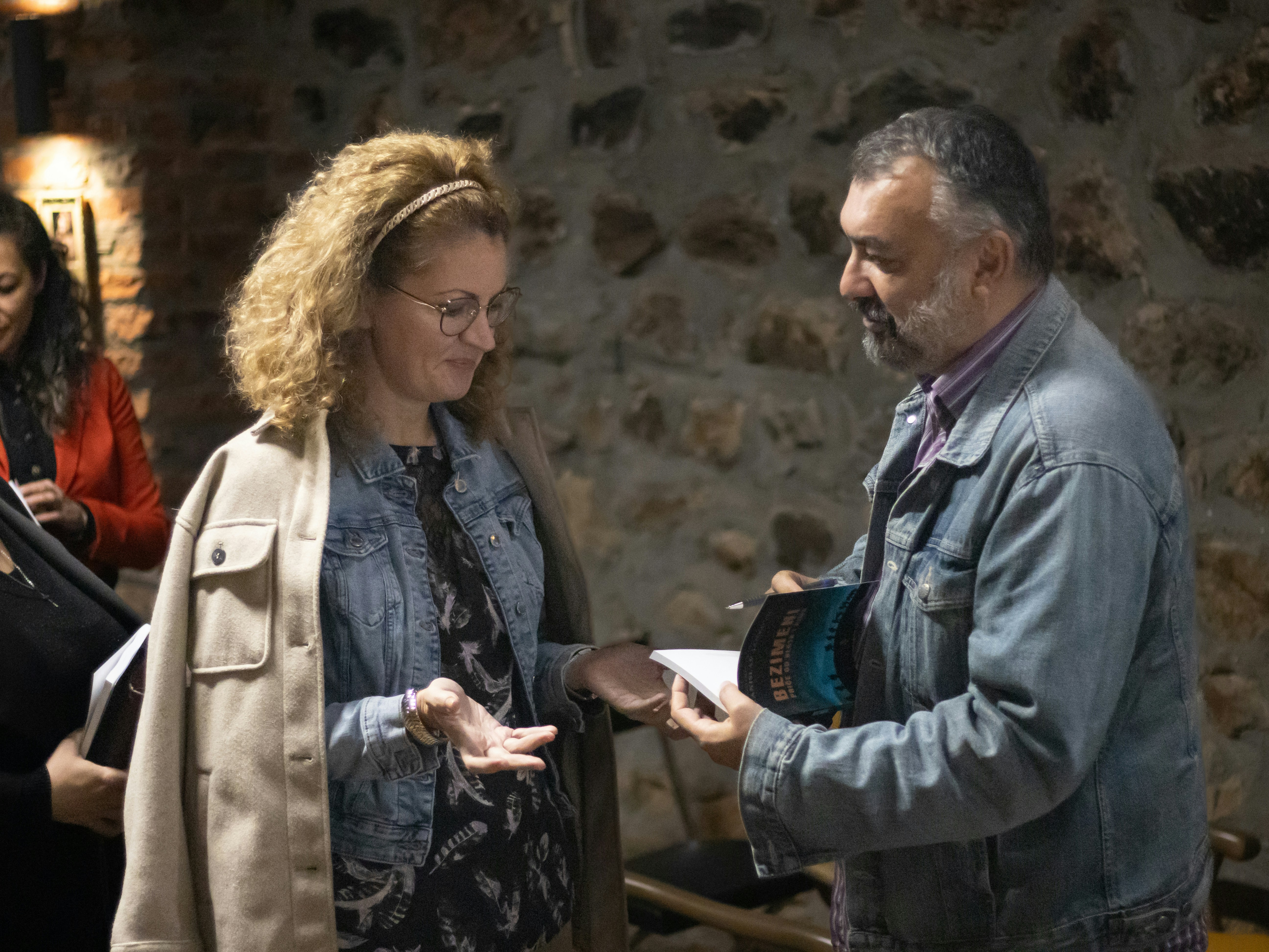 A group of people standing around each other