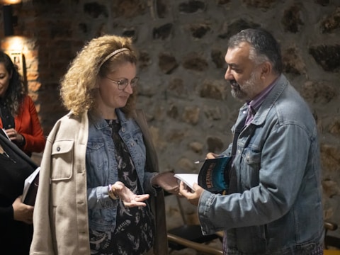 A group of people standing around each other