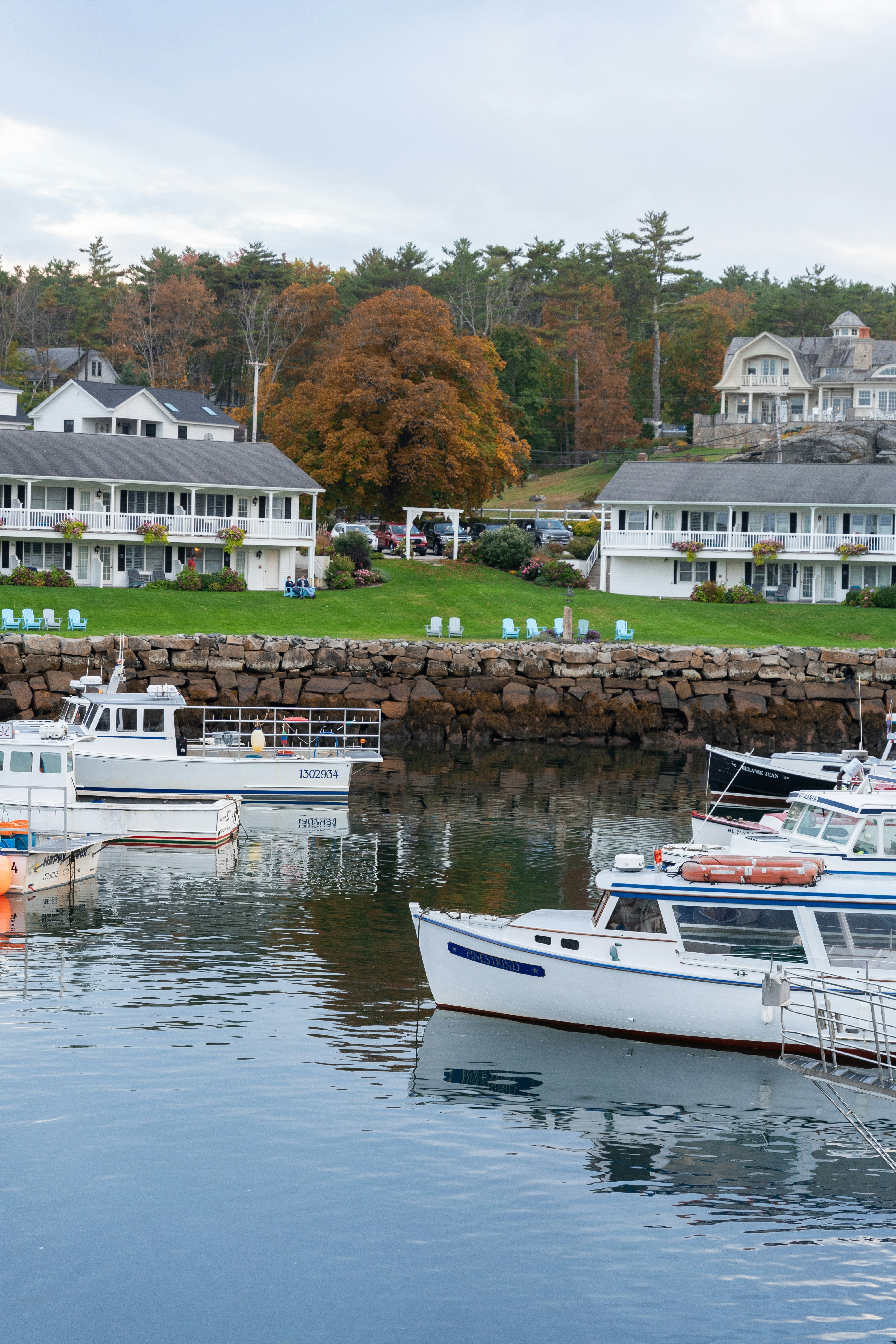A group of boats floating on top of a body of water
